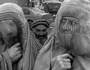 Woman in Burqa & La Rielera